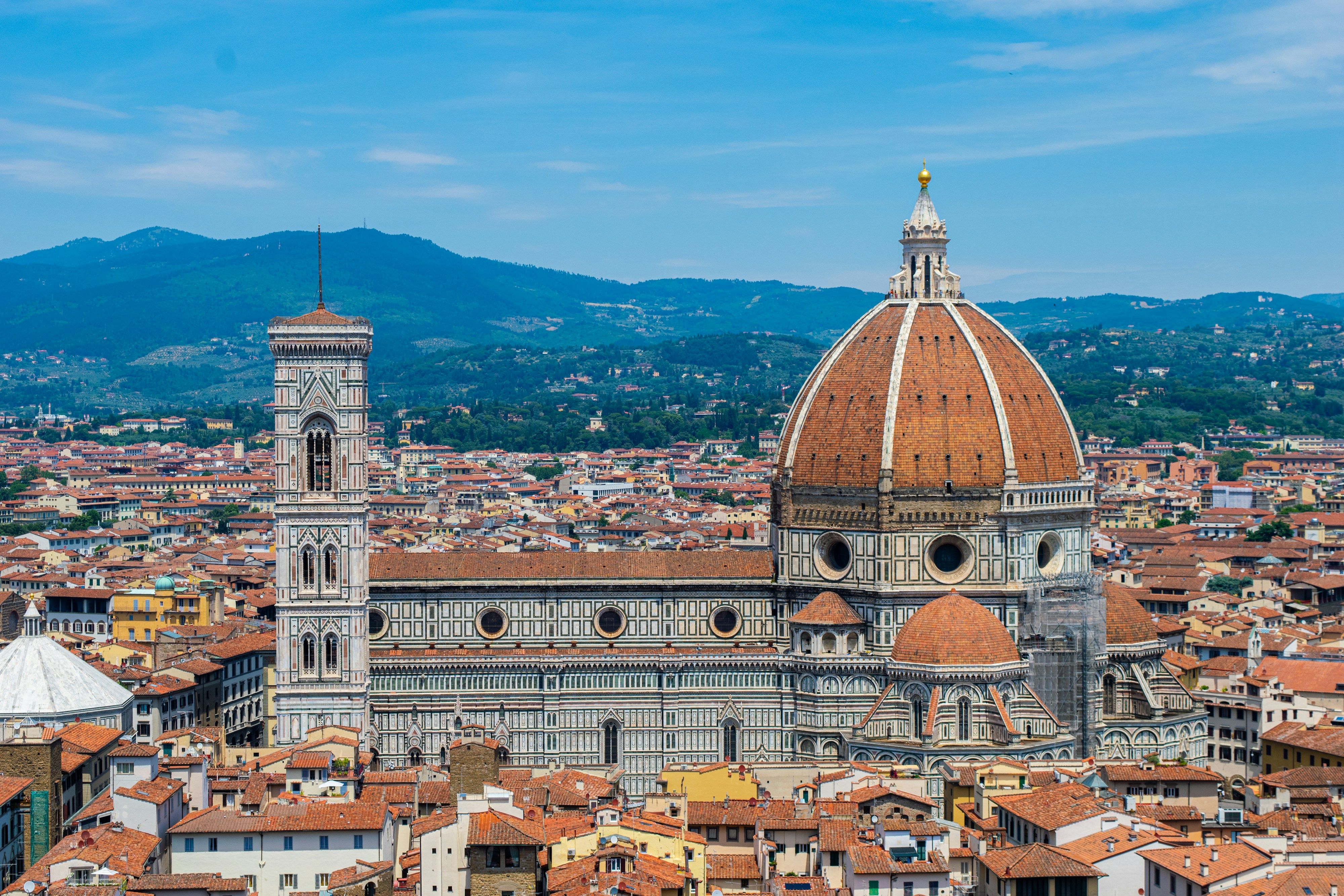 Florence seen from above, with the Duomo and the hills beyond