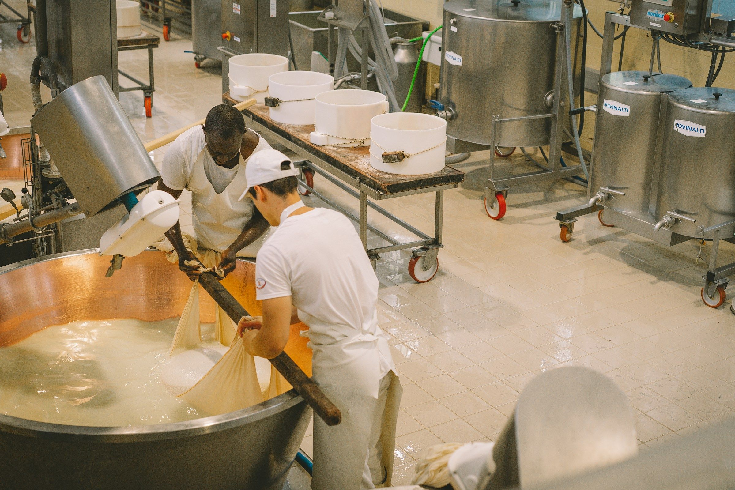 Cheesemakers at work in a Parmigiano Reggiano dairy